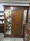 A Victorian mahogany triple wardrobe,