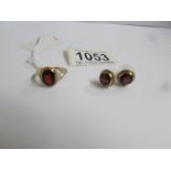 A 9ct gold ring set garnet and a pair of matching earrings.