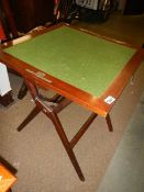 A mahogany folding card table.