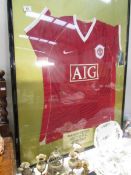 A framed and glazed signed Manchester United shirt, 2006/2007 season.