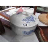 A rare chamber pot with matching lid.