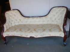 A Victorian mahogany cabriole leg double ended chaise longue.