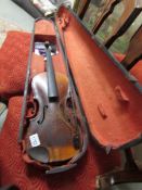 An old violin with one piece back complete with case and bow.