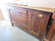 A mahogany sideboard.