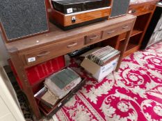 A walnut desk with 3 drawers.