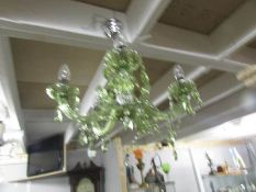 A green acrylic chandelier.