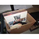 A box of LP and 48 rpm records, mostly 1980's.