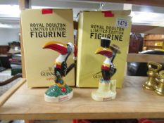 2 boxed Royal Doulton limited edition Guinness toucan figurines, Christmas and Seaside Town.