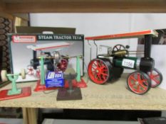A boxed Mamod TE1A steam tractor with implements.