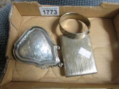A silver cigarette case, silver purse and silver bangle, approximately 173 grams.
