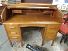 An oak double pedestal roll top desk,