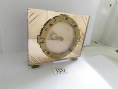 An art deco amber mirror glass mantel clock, in good working order.