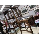 A pair of oak chairs.