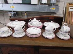 A quantity of floral decorated table ware.