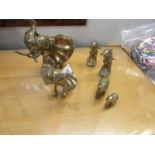 4 brass elephants and 2 dolphins.