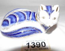 A Royal Crown Derby fox paperweight.