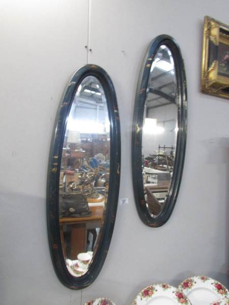 2 oval mirrors in lacquered frames. a/f.