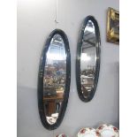 2 oval mirrors in lacquered frames. a/f.