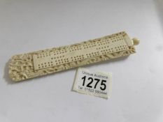An old carved ivory cribbage board.