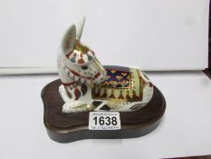A Royal Crown Derby paperweight, Donkey on wooden base.