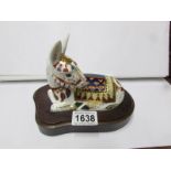 A Royal Crown Derby paperweight, Donkey on wooden base.