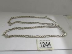 A long silver chain (32"), 53.9 grams.