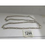 A long silver chain (32"), 53.9 grams.