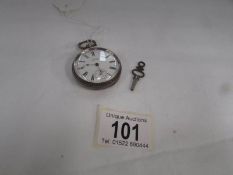 A silver Waltham & Co., fob watch with key and in working order (crack to dial).