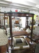 A mahogany side table with glass top and underlay.