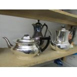 A matching silver plate teapot and coffee pot and one other coffee pot.