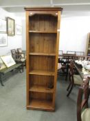 A tall pine book case.