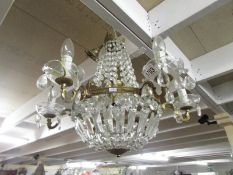 A vintage 6 lamp glass and gilded chandelier.