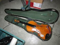 An old violin with one piece back and 'BAUSCH' bridge in a case.