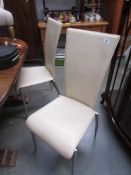 A set of 4 retro style leather dining chairs,