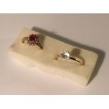 A diamond/ruby cluster ring and a white stone ring both in 9ct gold.