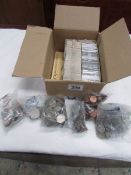 A box containing a large quantity of US and other foreign coins,