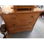 A 3 drawer pine chest.