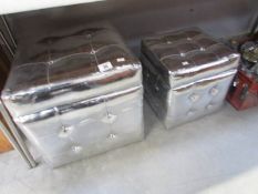 2 silver coloured storage stools.