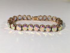 A yellow gold and topaz bracelet.