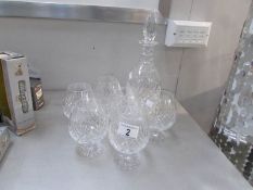 A fine quality crystal decanter and 6 brandy goblets.