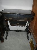 A Victorian ebonised fold over games table.