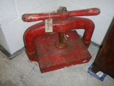 A heavy cast iron book press.