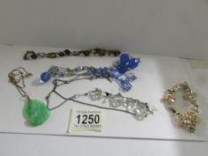 4 circa 1940's necklaces.
