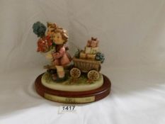 A boxed Hummel Goebel Century collection figure group 'Love's Bounty'.