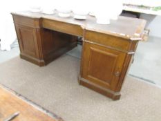 A large oak partner's desk.