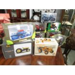 9 boxed Universal Hobbies die cast tractors.