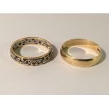 A 9ct gold wedding band size P and a 9ct gold eternity ring size P.