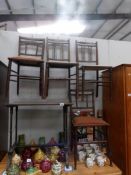 A pair of inlaid chairs with matching table and another pair of chairs.