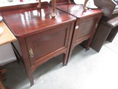 A pair of bedroom pot cupboards.