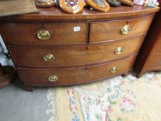 A 2 over 2 mahogany bow front chest of drawers.